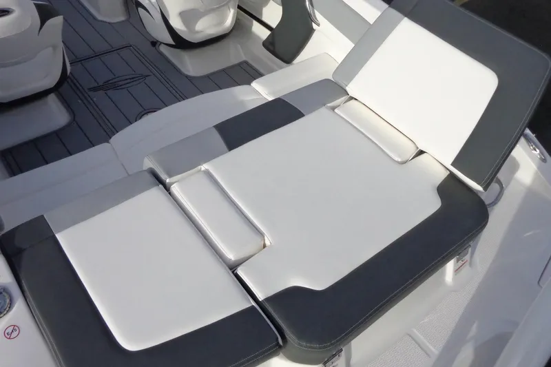 Slide: The Image of 2024 Chaparral 19 SSi OB boat interior with cushioned seating and sleek design. - 5