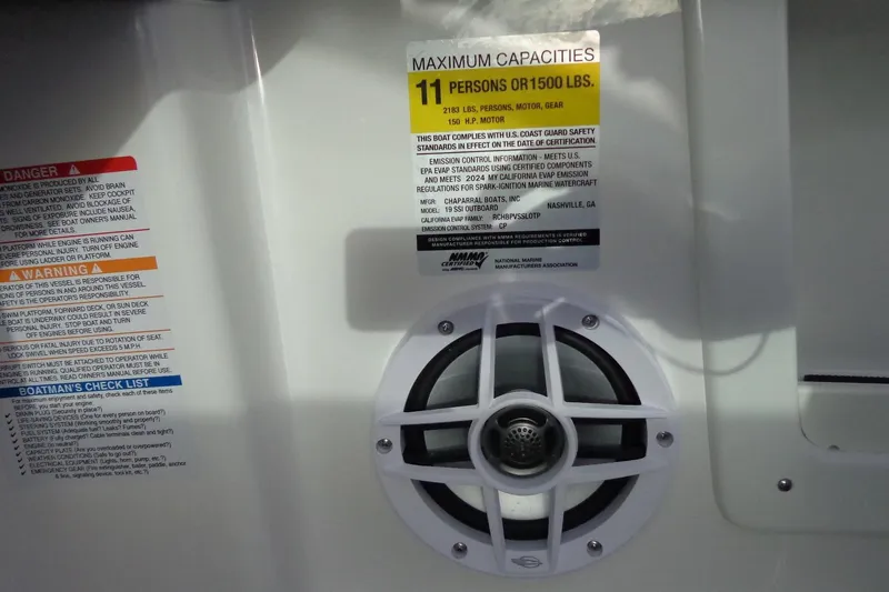 Slide: The Image of 2024 Chaparral 19 SSi OB boat capacity label and speaker detail. - 9