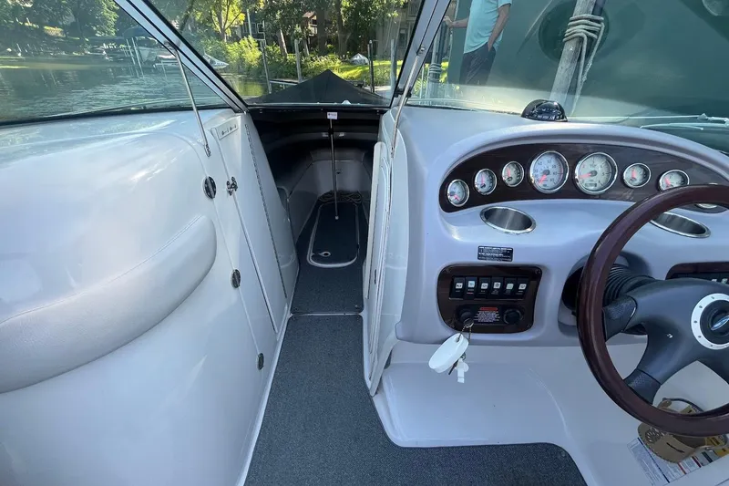 Slide: The Image of 2005 Chaparral 260 SSi boat interior with dashboard and steering wheel. - 10