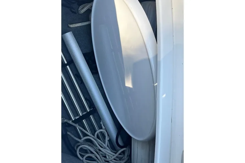 Slide: The Image of Storage compartment of 2005 Chaparral 260 SSi boat with ropes and equipment. - 20