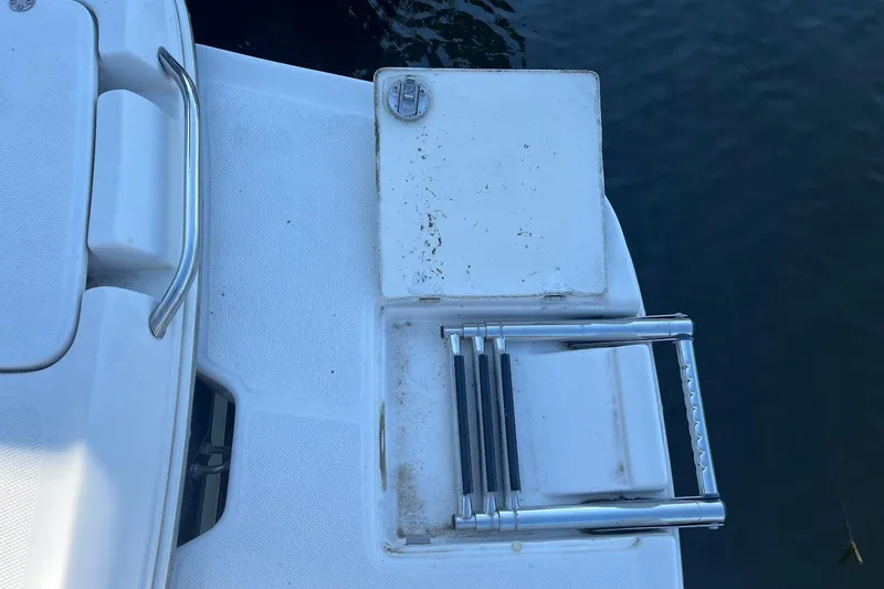 Slide: The Image of 2005 Chaparral 260 SSi boat swim platform with foldable ladder. - 27