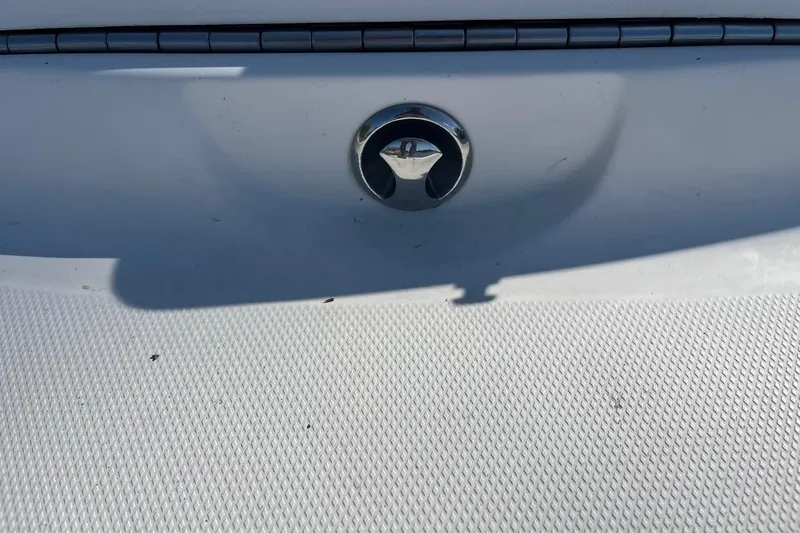 Slide: The Image of 2005 Chaparral 260 SSi boat detail with chrome hardware and textured surface. - 28