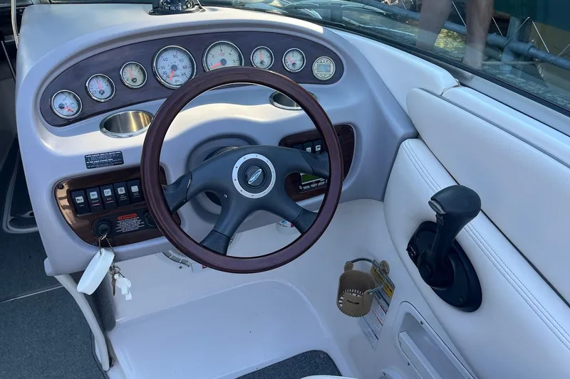 Slide: The Image of 2005 Chaparral 260 SSi boat dashboard with steering wheel and control panel. - 6
