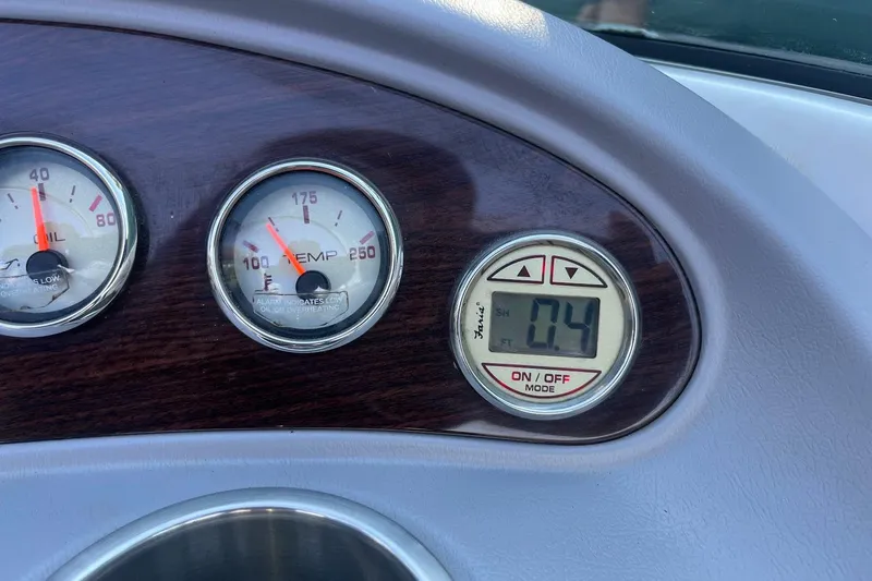 Slide: The Image of Dashboard gauges of a 2005 Chaparral 260 SSi boat, showing oil and temperature readings. - 8