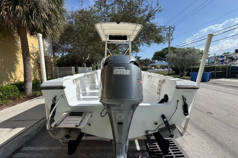 Slide: The Image of 1988 Pursuit C 200 Center Console boat with Yamaha 200 outboard motor, parked outdoors. - 3