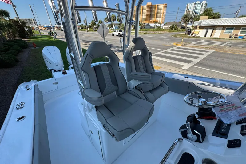 Slide: The Image of 2026 Cape Horn 31 T boat interior with Garmin electronics, docked under clear blue sky. - 16