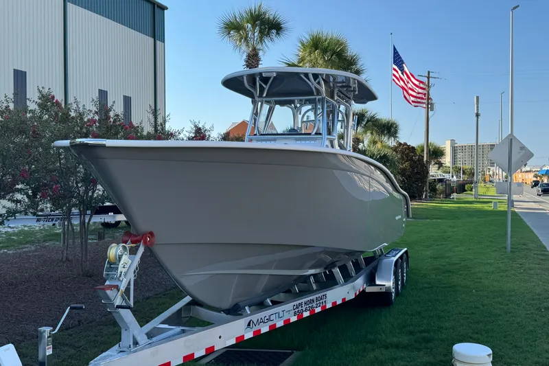 Slide: The Image of 2026 Cape Horn 31 T boat with dual outboard engines on a trailer. - 3