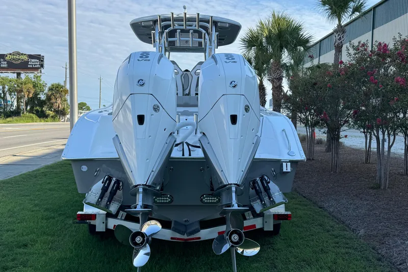 Slide: The Image of 2026 Cape Horn 31 T boat with Mercury engine on trailer, under clear blue sky. - 6