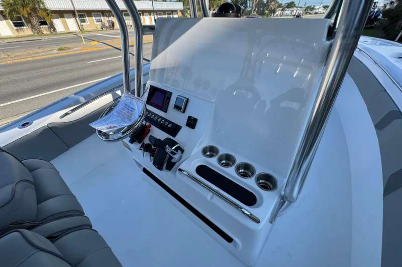 Slide: The Image of 2026 Cape Horn 31 T boat on display at a dealership under clear blue skies. - 17