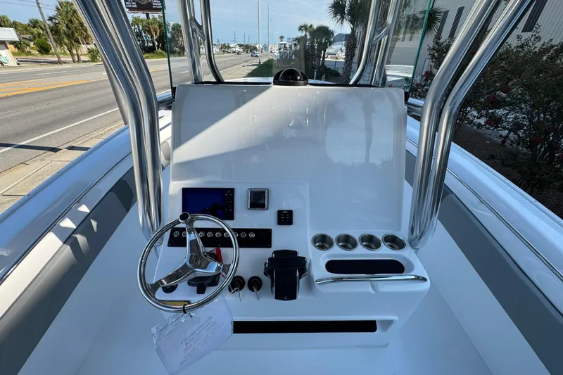 Slide: The Image of 2026 Cape Horn 31 T boat displayed at a marina under clear blue skies. - 18