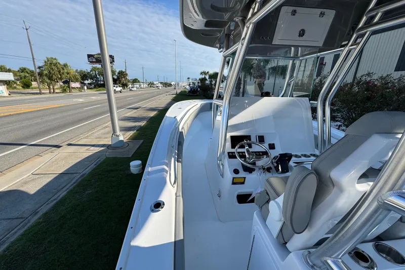 Slide: The Image of 2026 Cape Horn 31 T boat with sleek T-top design under clear blue sky. - 20