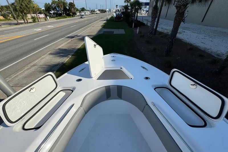 Slide: The Image of 2026 Cape Horn 31 T boat storage compartment with open tackle boxes. - 24