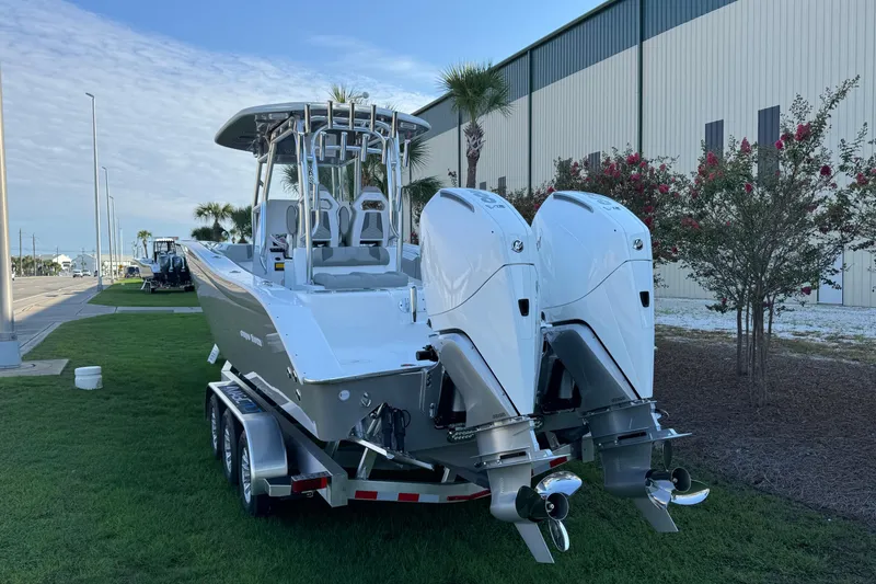 Slide: The Image of 2026 Cape Horn 31 T boat with dual outboard engines on a trailer. - 5
