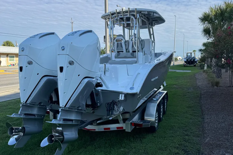 Slide: The Image of 2026 Cape Horn 31 T boat on trailer outside a large warehouse. - 7