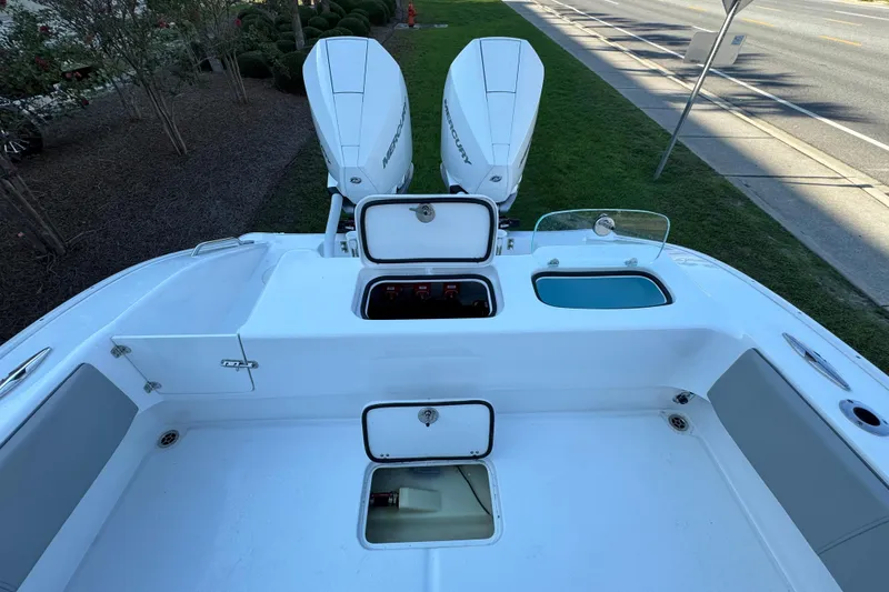 Slide: The Image of 2026 Cape Horn 31 T boat with dual Mercury outboard engines in a marina setting. - 9