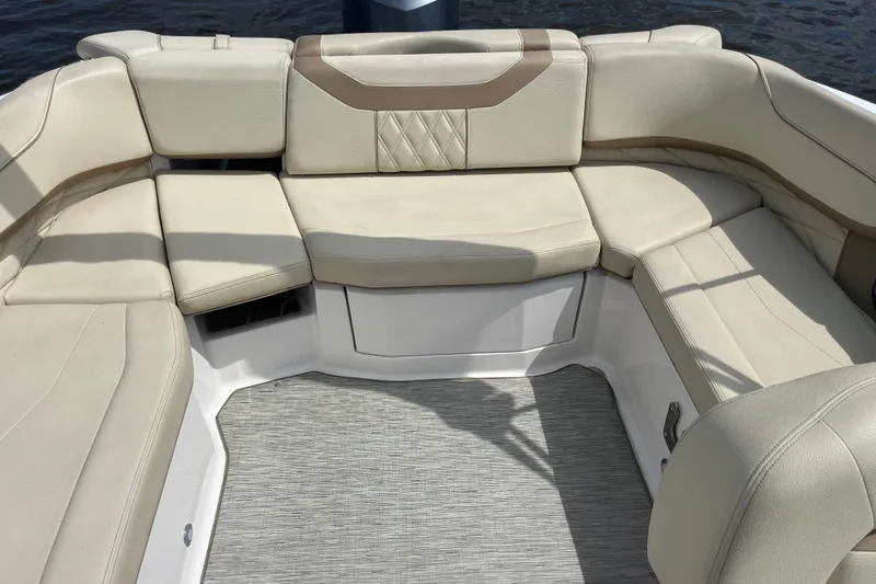Slide: The Image of 2019 Regal 23 OBX boat interior with storage compartment and portable toilet. - 14