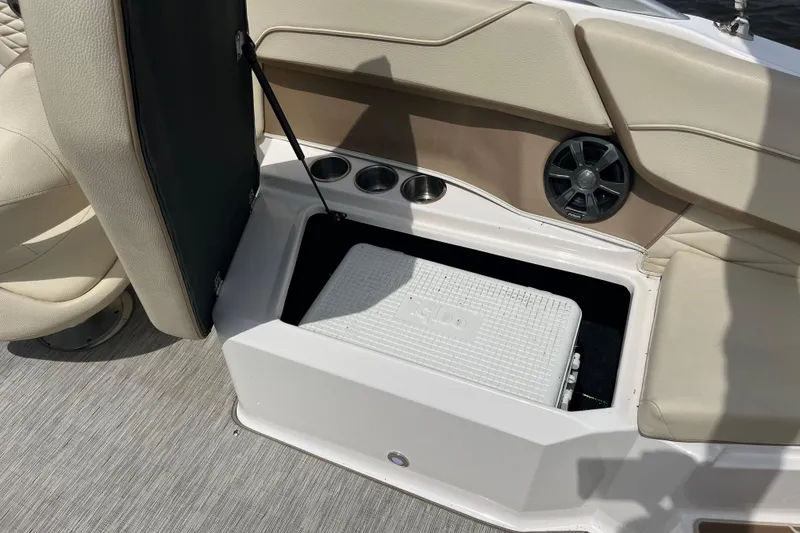 Slide: The Image of 2019 Regal 23 OBX boat interior with beige cushioned seating. - 15