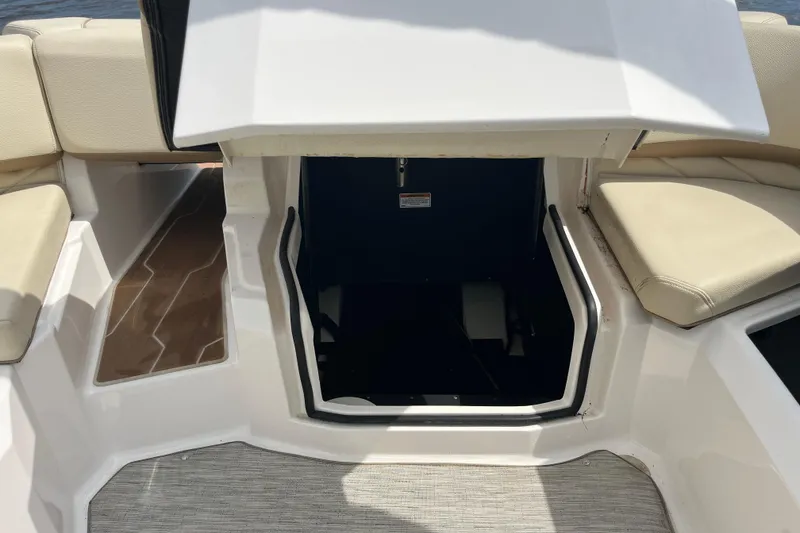 Slide: The Image of 2019 Regal 23 OBX boat with Yamaha 250 engine, featuring beige seating and deck. - 18