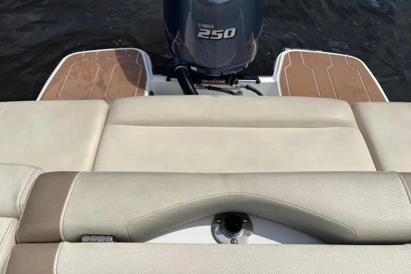 Slide: The Image of 2019 Regal 23 OBX boat with Yamaha 250 outboard motor on water. - 21