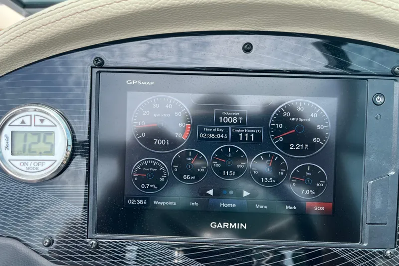 Slide: The Image of 2019 Regal 23 OBX boat on trailer in covered storage area. - 3