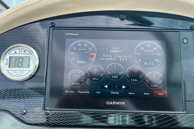 Slide: The Image of Garmin GPS display on 2019 Regal 23 OBX boat dashboard showing speed and engine metrics. - 4