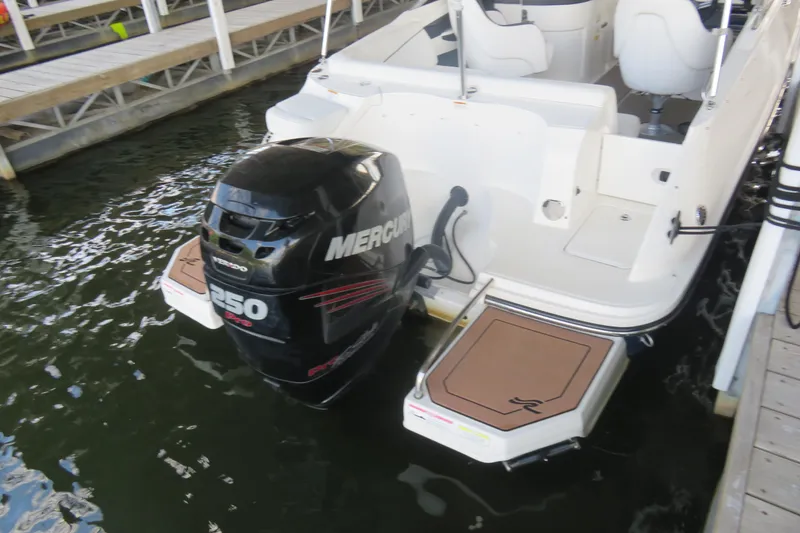 Slide: The Image of 2014 Sea Ray 220 Sundeck Outboard with Mercury 250 Pro motor at dock. - 9