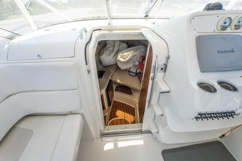 Slide: The Image of Dashboard of 2010 Triton 301XD boat with Garmin GPS displays and gauges. - 20