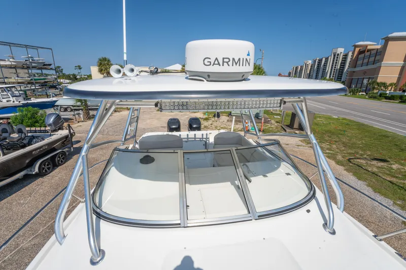 Slide: The Image of Triton 301XD 2010 boat with Garmin radar on top, clear blue sky background. - 28