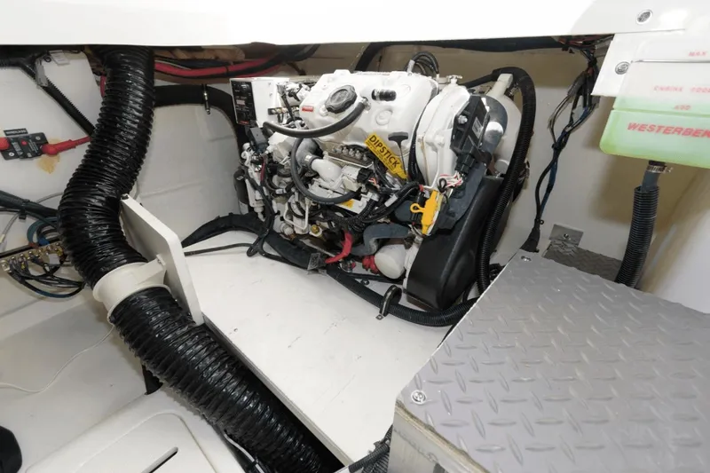 Slide: The Image of Engine compartment of 2023 Sea Ray Sundancer 320 Outboard with visible components and wiring. - 16