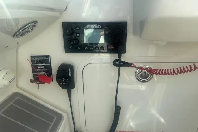 Slide: The Image of Control panel of 2023 Sea Ray Sundancer 320 Outboard with Simrad electronics. - 22