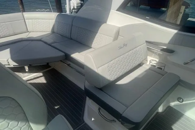 Slide: The Image of 2023 Sea Ray Sundancer 320 Outboard interior with luxurious seating and modern design. - 38