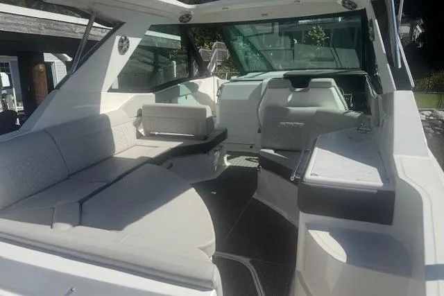 Slide: The Image of 2023 Sea Ray Sundancer 320 Outboard interior with spacious seating and modern design. - 42