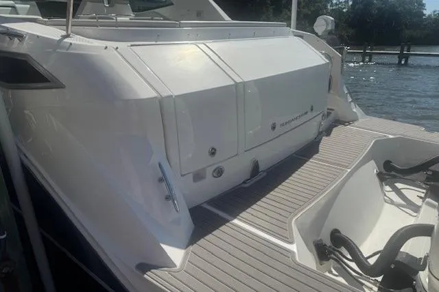 Slide: The Image of 2023 Sea Ray Sundancer 320 Outboard, rear view on dock, sunny day. - 43