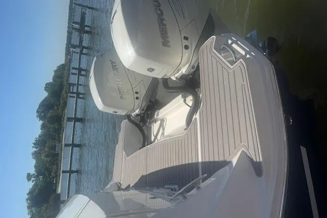 Slide: The Image of 2023 Sea Ray Sundancer 320 Outboard with dual Mercury engines on water. - 44