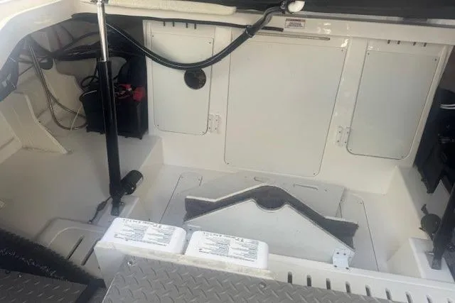 Slide: The Image of 2023 Sea Ray Sundancer 320 Outboard interior, showcasing storage compartments and deck details. - 49