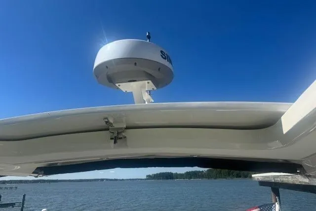 Slide: The Image of 2023 Sea Ray Sundancer 320 Outboard radar against clear blue sky and water backdrop. - 50