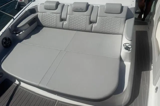 Slide: The Image of 2023 Sea Ray Sundancer 320 Outboard, spacious gray seating area on deck. - 51