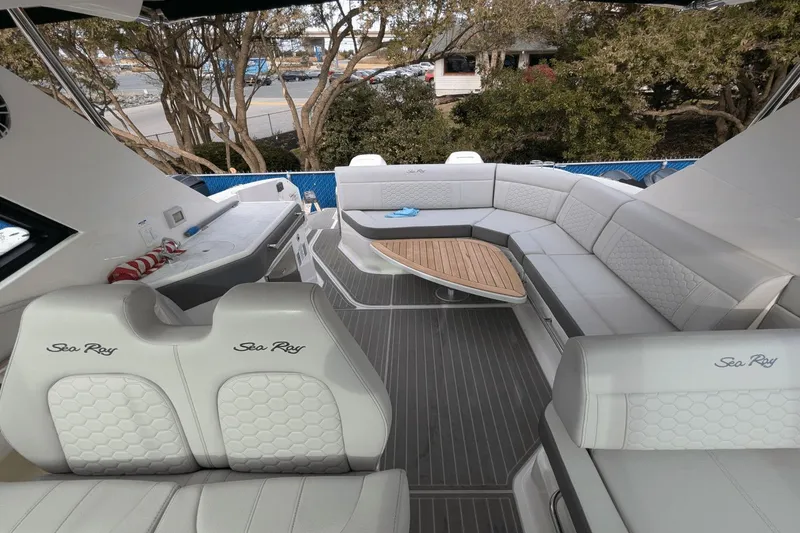 Slide: The Image of Luxurious 2023 Sea Ray Sundancer 320 Outboard interior with plush seating and elegant design. - 8
