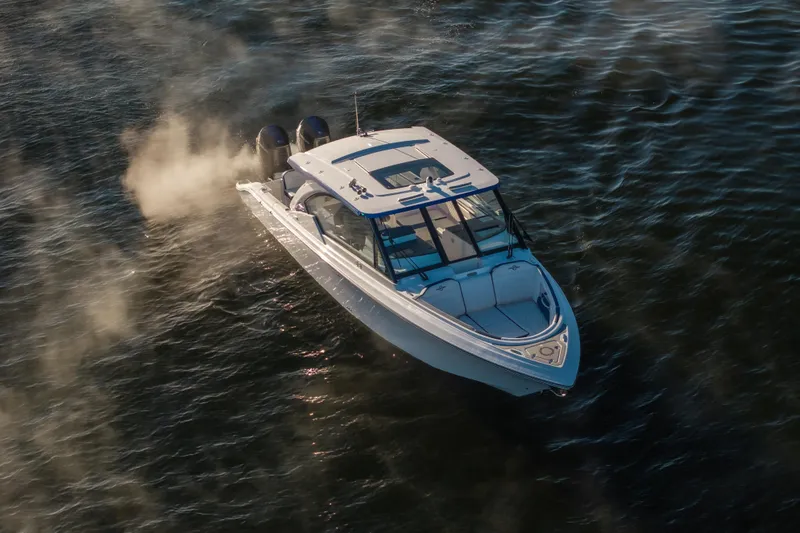 Slide: The Image of 2026 Fountain 39 DX boat cruising on water, aerial view. - 11