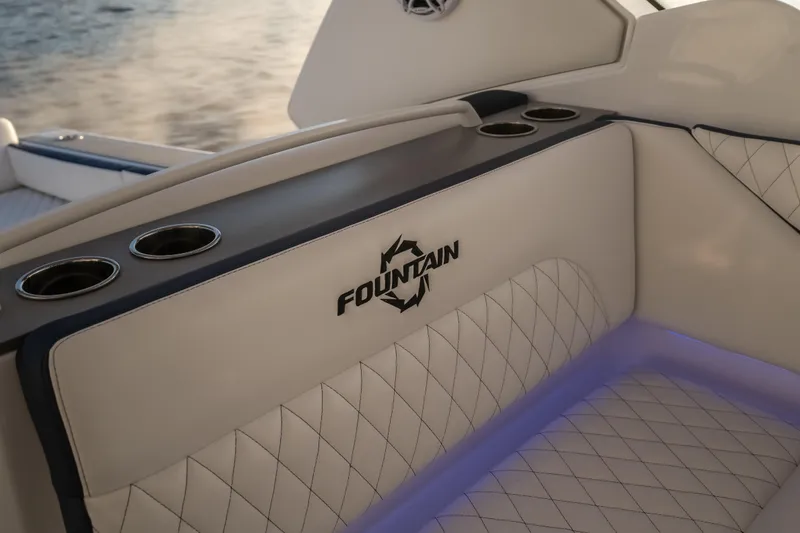 Slide: The Image of Luxurious interior of 2026 Fountain 39 DX boat with elegant seating and cup holders. - 12