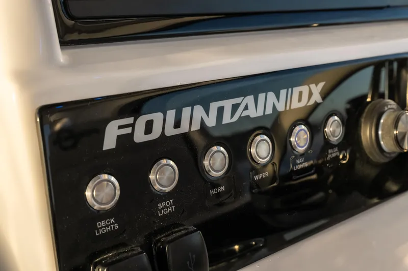 Slide: The Image of Control panel of 2026 Fountain 39 DX boat with labeled buttons and switches. - 14