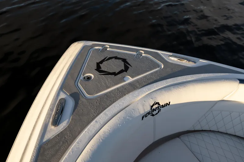 Slide: The Image of Bow of 2026 Fountain 39 DX boat with logo, on calm water. - 24