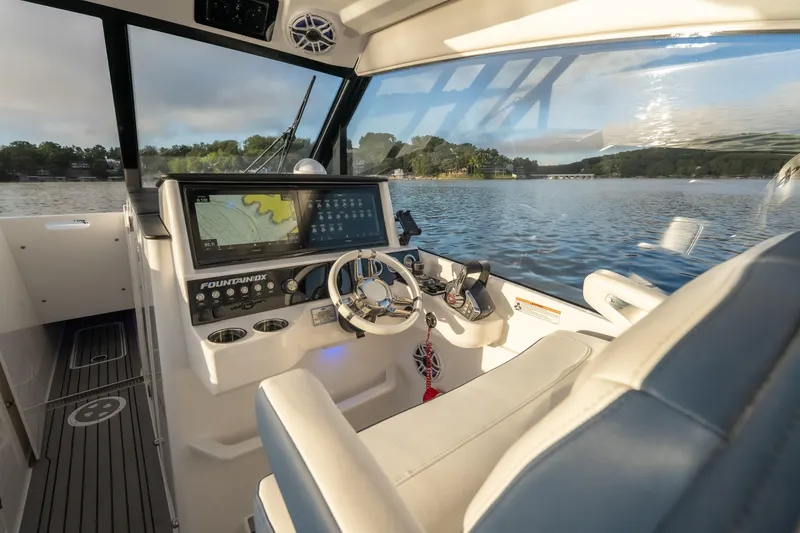 Slide: The Image of Interior view of 2026 Fountain 39 DX boat cockpit with navigation system. - 28