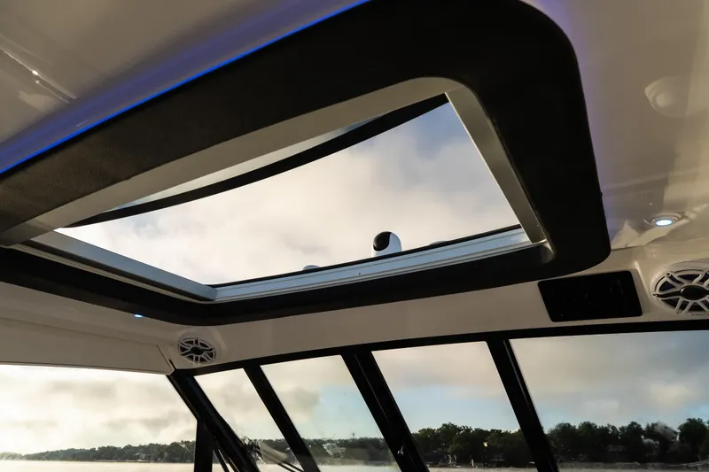 Slide: The Image of Interior view of 2026 Fountain 39 DX boat with skylight and speakers. - 31