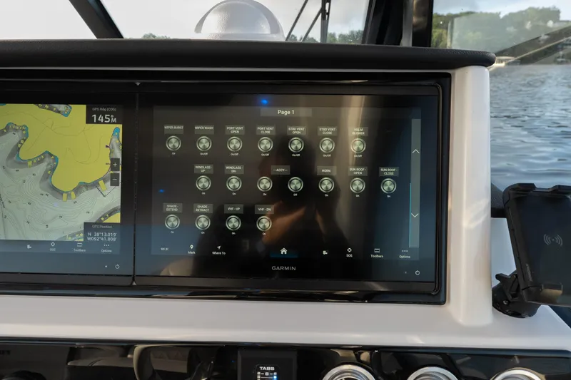 Slide: The Image of Control panel of 2026 Fountain 39 DX boat with navigation and system controls. - 33