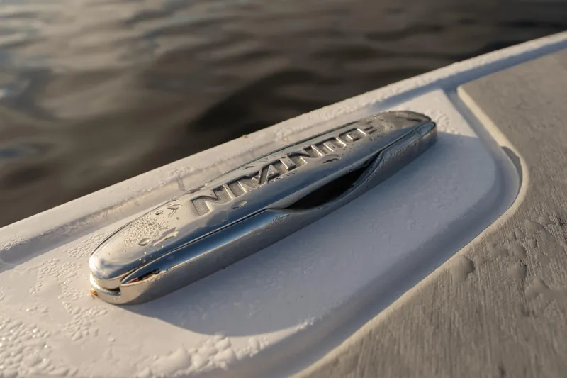 Slide: The Image of Close-up of a 2026 Fountain 39 DX boat cleat with water droplets. - 34