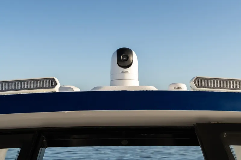 Slide: The Image of 2026 Fountain 39 DX boat with advanced camera and Garmin equipment on deck. - 38