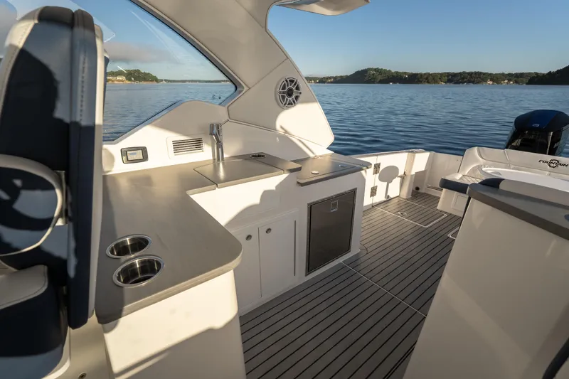 Slide: The Image of Luxurious 2026 Fountain 39 DX boat interior with sleek kitchen and scenic water view. - 41