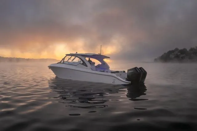 Slide: The Image of 2026 Fountain 39 DX boat on misty water at sunrise. - 5