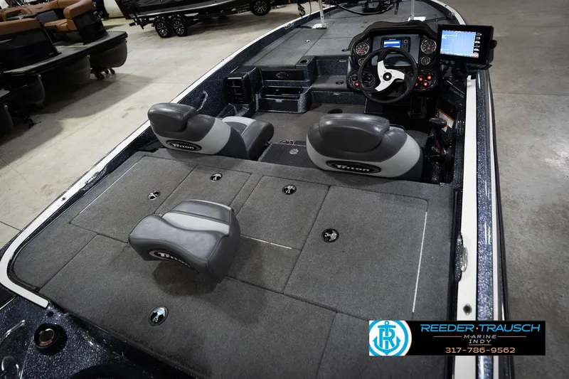 Slide: The Image of 2015 Triton 18TRX boat interior with dual seats and control panel. - 12
